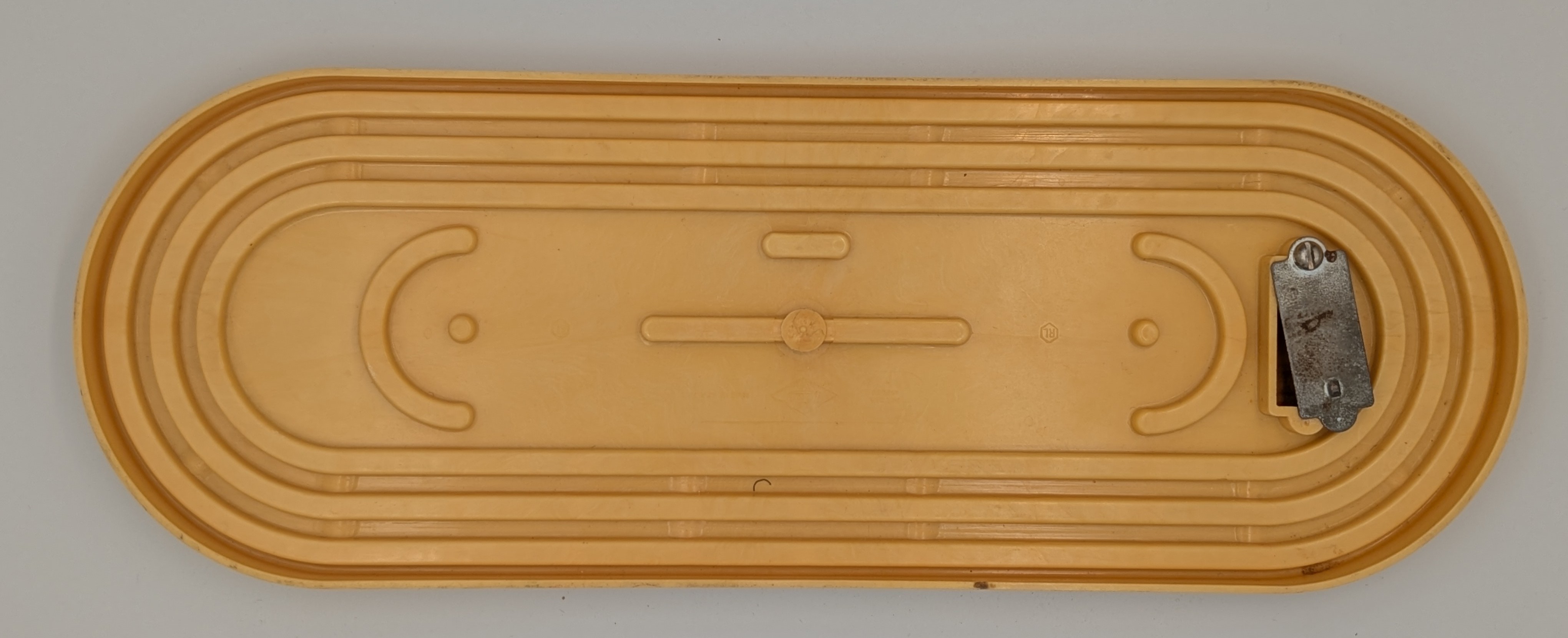 There is a storage compartment for the pegs (it always opens by itself).