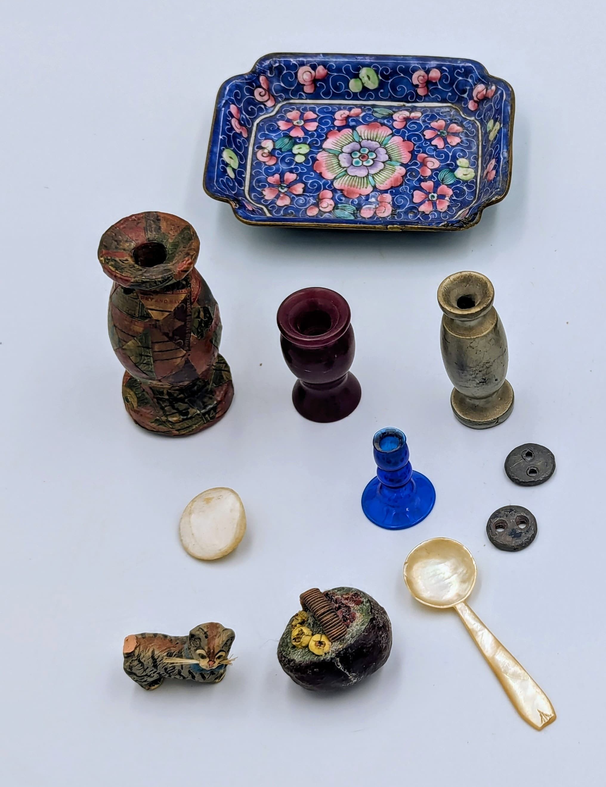 The cat is missing its tail. The decoupage on the larger wooden vase is interesting. 